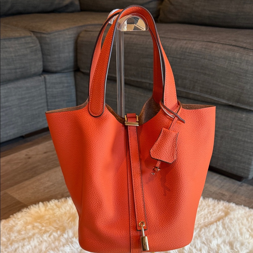 Orange Bucket Bag with a small pouch inside. Size 22cm